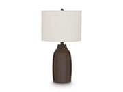 Ashley Furniture Jyler table lamp with a sleek, modern design and a white lampshade on a wooden base.