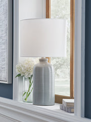 Wimlow Ashley Furniture table lamp with a ceramic base and fabric shade, placed on a wooden side table.