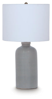 Ashley Furniture Wimlow table lamp with a sleek design, featuring a neutral-colored shade and a modern base.