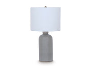 Ashley Furniture Wimlow table lamp with a sleek design and neutral-colored lampshade, perfect for living room or bedroom decor.
