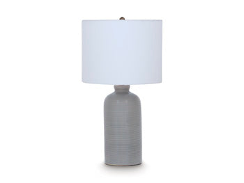 Ashley Furniture Wimlow table lamp with a sleek design and neutral-colored lampshade, perfect for living room or bedroom decor.