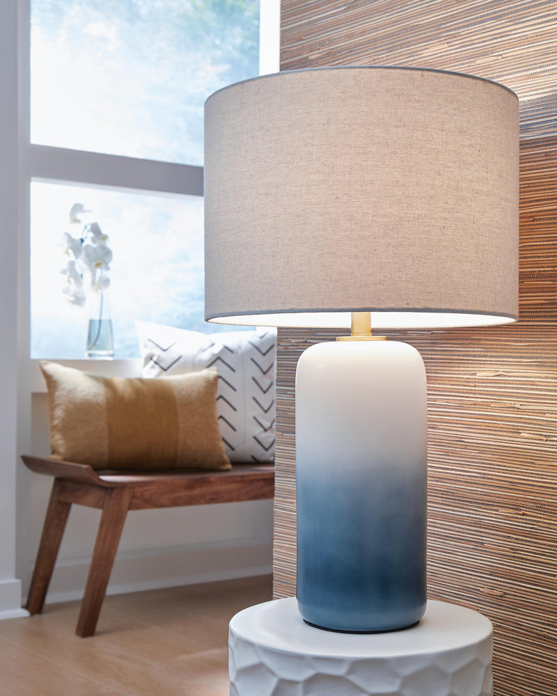 Pair of Lemrich table lamps from Ashley Furniture featuring beige drum shades and dark metal bases for a modern living room decor.