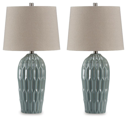 Pair of Hadbury table lamps by Ashley Furniture with cream fabric shades and dark bronze bases on a wooden surface.