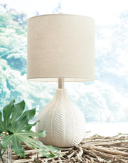 Ashley Furniture Rainermen Lamp Set featuring two stylish table lamps with fabric shades and wooden bases on a modern side table.