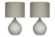 Ashley Furniture Wardmont Lamp Set featuring two stylish table lamps with beige shades and dark bronze bases.