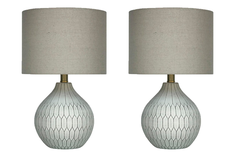 Ashley Furniture Wardmont Lamp Set featuring two stylish table lamps with beige shades and dark bronze bases.