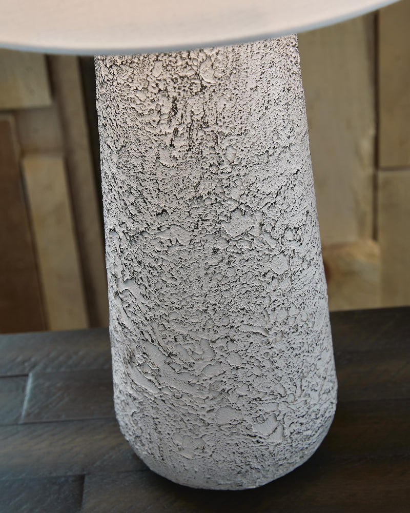 Pair of Ashley Furniture Chaston table lamps with beige fabric shades and dark bronze bases, perfect for bedside or living room decor.