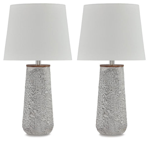 Pair of Ashley Furniture Chaston table lamps with beige drum shades and bronze bases, placed on a wooden surface.
