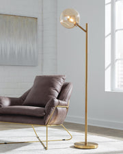 Ashley Furniture Abanson floor lamp with a tall, sleek design and a fabric shade, perfect for modern living room lighting.