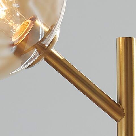 Ashley Furniture Abanson floor lamp with a sleek metal finish and modern design, standing tall with a fabric lampshade.