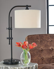 Ashley Furniture Baronvale Lamp Set featuring two elegant table lamps with neutral shades and decorative bases.