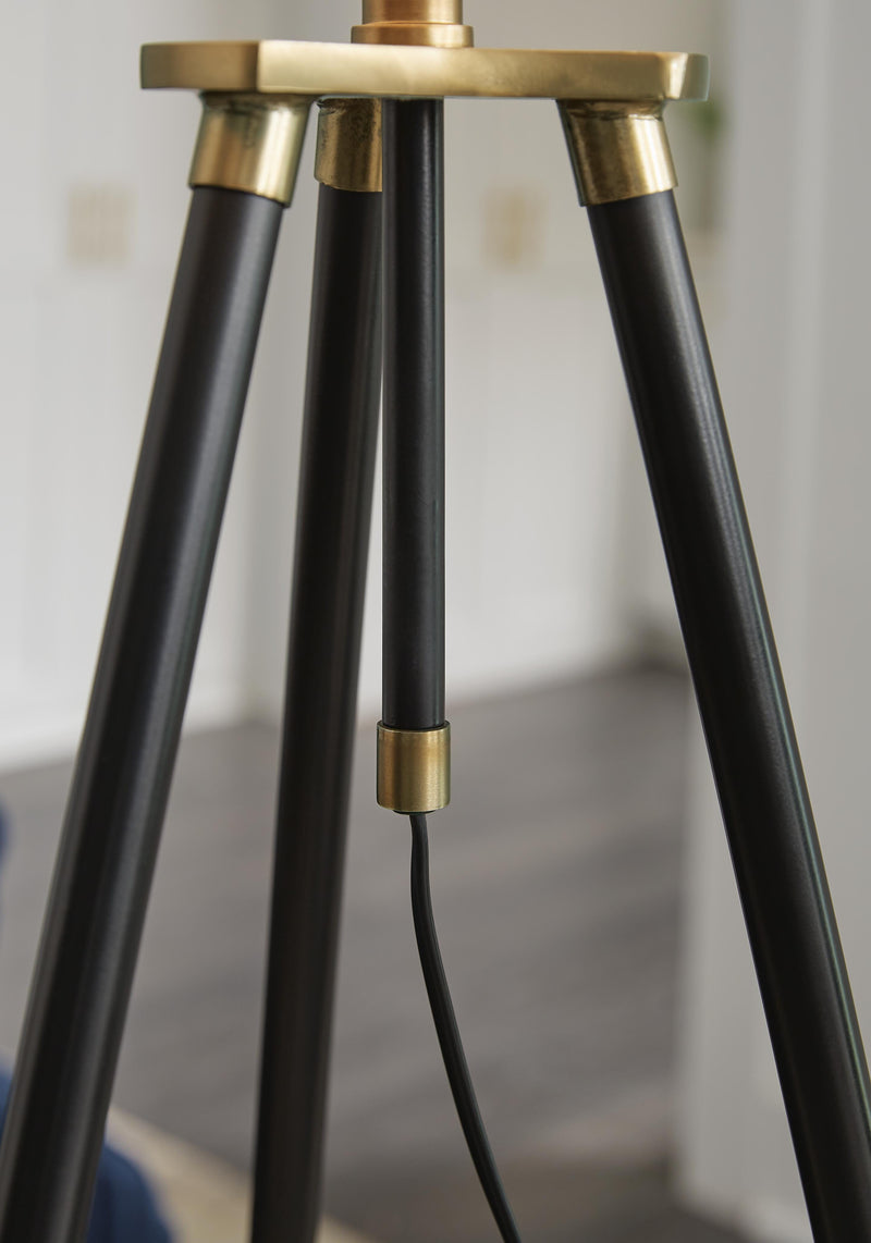 Close-up of the Cashner Floor Lamp by Ashley Furniture, showing the detailed cord and elegant design features.