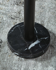 Detailed view of the base of the Ashley Furniture Sorcha Floor Lamp, showcasing its elegant design and finish.