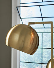 Close-up of the shade detail on the Sorcha Floor Lamp by Ashley Furniture showing its stylish design and textured fabric.