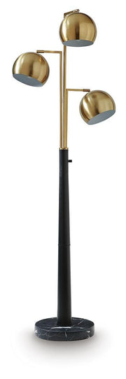 Ashley Furniture Sorcha floor lamp with a tall, sleek design and fabric shade, standing on a wooden floor.