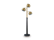 Ashley Furniture Sorcha floor lamp with a tall, elegant design and a fabric lampshade in a modern living space.