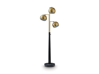 Ashley Furniture Sorcha floor lamp with a tall, elegant design and a fabric lampshade in a modern living space.