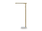 Ashley Furniture Santiford floor lamp with a sleek design and tall, modern structure standing on a hardwood floor.
