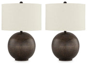 Ashley Furniture Hambell table lamp set with two modern lamps featuring sleek bases and fabric shades on a wooden surface.