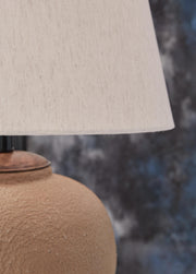 Ashley Furniture Scantor table lamp set featuring stylish shades and elegant bases, ideal for modern living room decor.