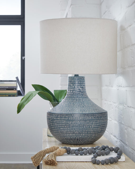 Ashley Furniture Schylarmont table lamp set with two modern ceramic lamps featuring textured bases and fabric shades.