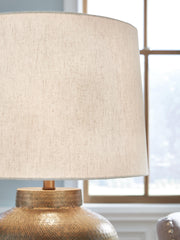 Close-up of Ashley Furniture Madney Lamp Set table lamps with detailed beige shades and decorative bases.