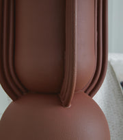 Ashley Furniture Rowandale table lamp with a textured ceramic base and fabric shade, ideal for bedroom or living room decor.