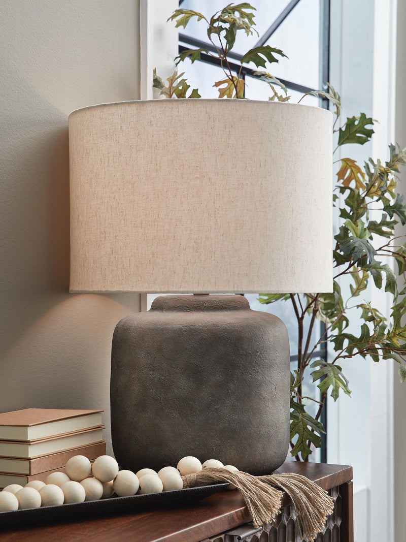 Ashley Furniture Zandophen table lamp with a modern design, featuring a sleek base and a stylish fabric lampshade.