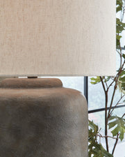Close-up of Zandophen table lamp by Ashley Furniture showcasing its detailed ceramic base and fabric lampshade.
