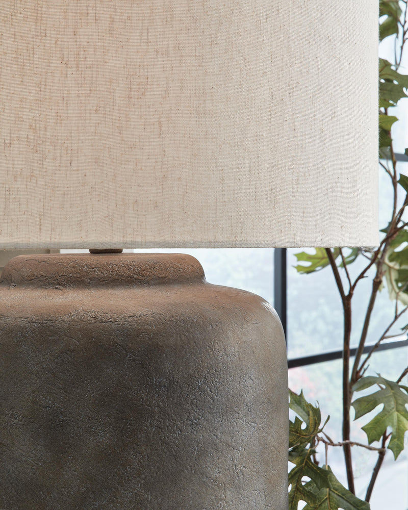 Close-up of Zandophen table lamp by Ashley Furniture showcasing its detailed ceramic base and fabric lampshade.