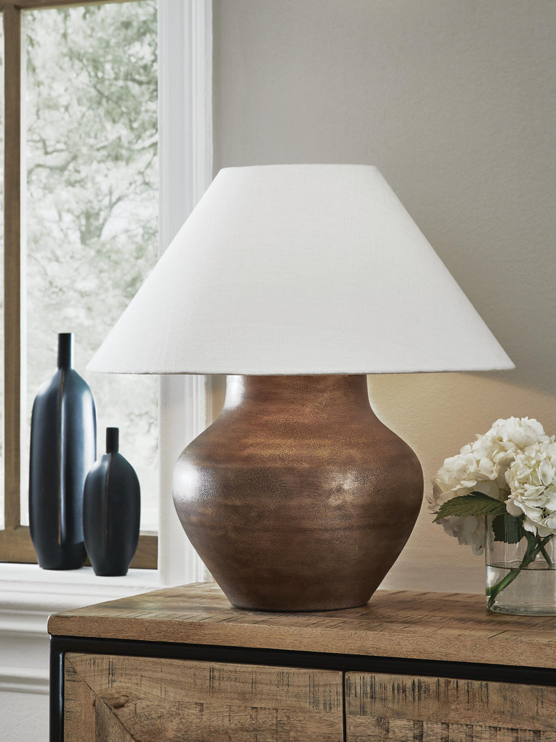 Ashley Furniture Whitham table lamp with a sleek base and fabric shade, perfect for modern home decor.