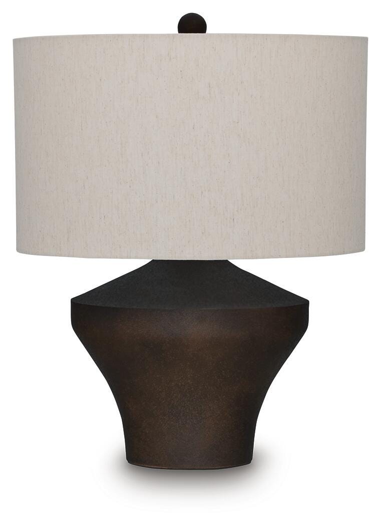 Ashley Furniture Dolanham table lamp with a sleek base and fabric shade, perfect for adding style to any living space.