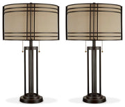 Ashley Furniture Hanswell table lamp set with two modern lamps featuring neutral-colored shades and sleek bases.