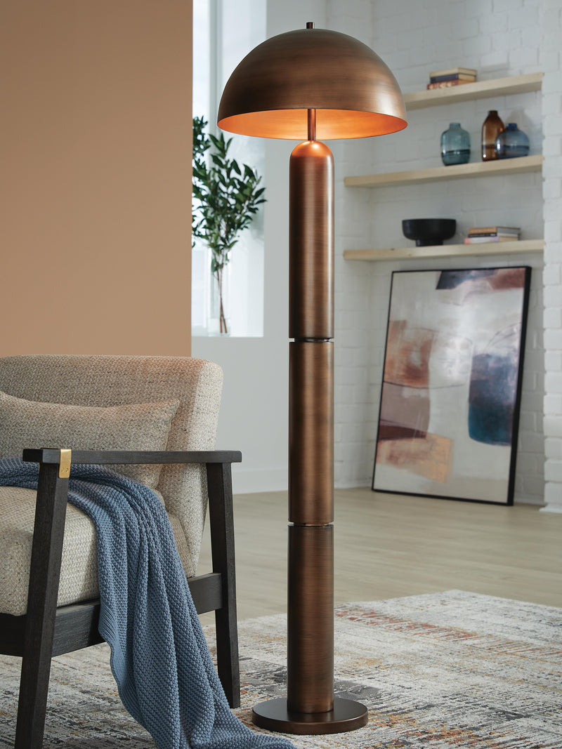 Ashley Furniture Wendfield Floor Lamp with a sleek design, standing tall with a fabric shade and modern metal base.