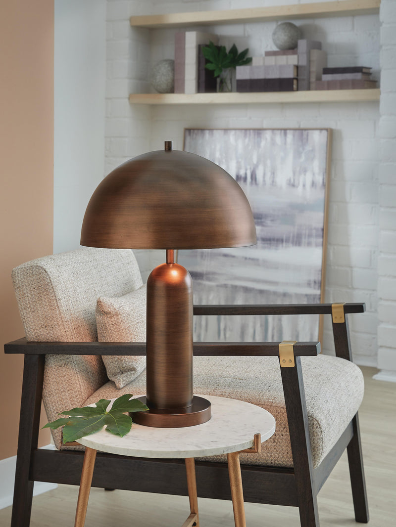 Ashley Furniture Wendfield table lamp with a sleek base and fabric shade, perfect for enhancing home decor.