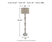 Set of two Ashley Furniture Bernadate floor lamps with elegant fabric shades and sleek metal bases.
