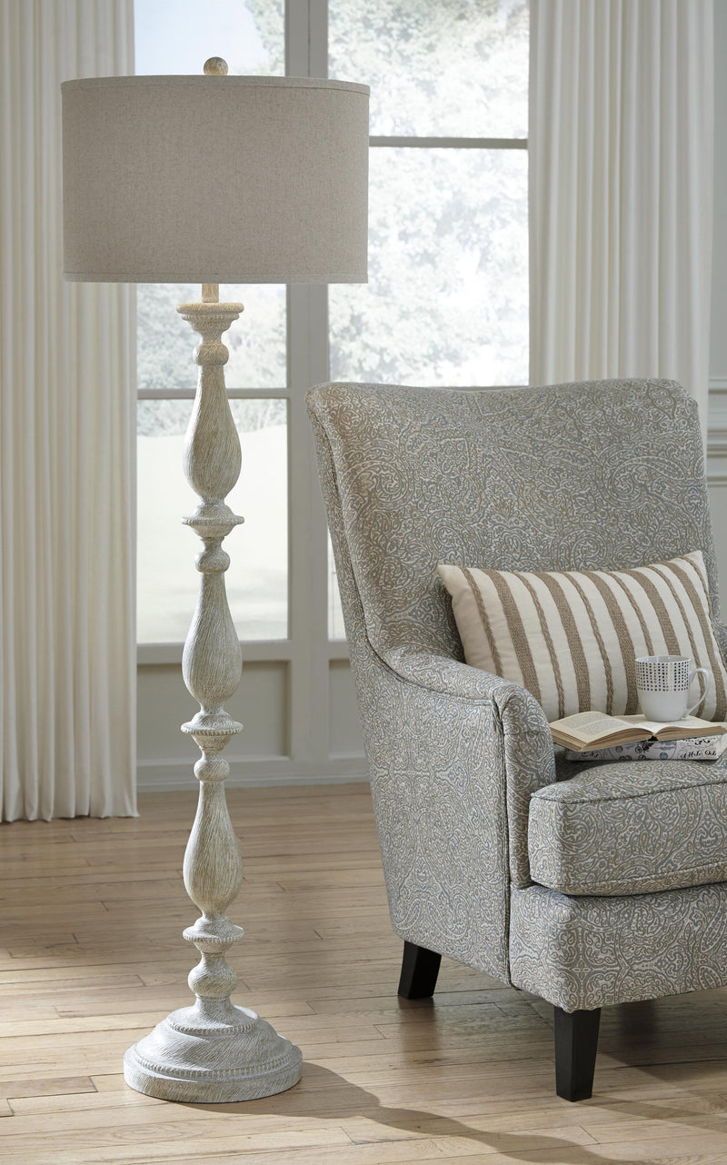 Ashley Furniture Bernadate lamp set featuring two elegant floor lamps with fabric shades and a modern design.