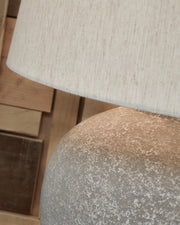 Ashley Furniture Dreward table lamp set featuring two elegant lamps with neutral shades and decorative bases.
