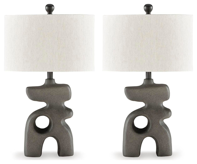 Ashley Furniture Danacy table lamp set with two stylish lamps featuring neutral-colored shades and modern bases.