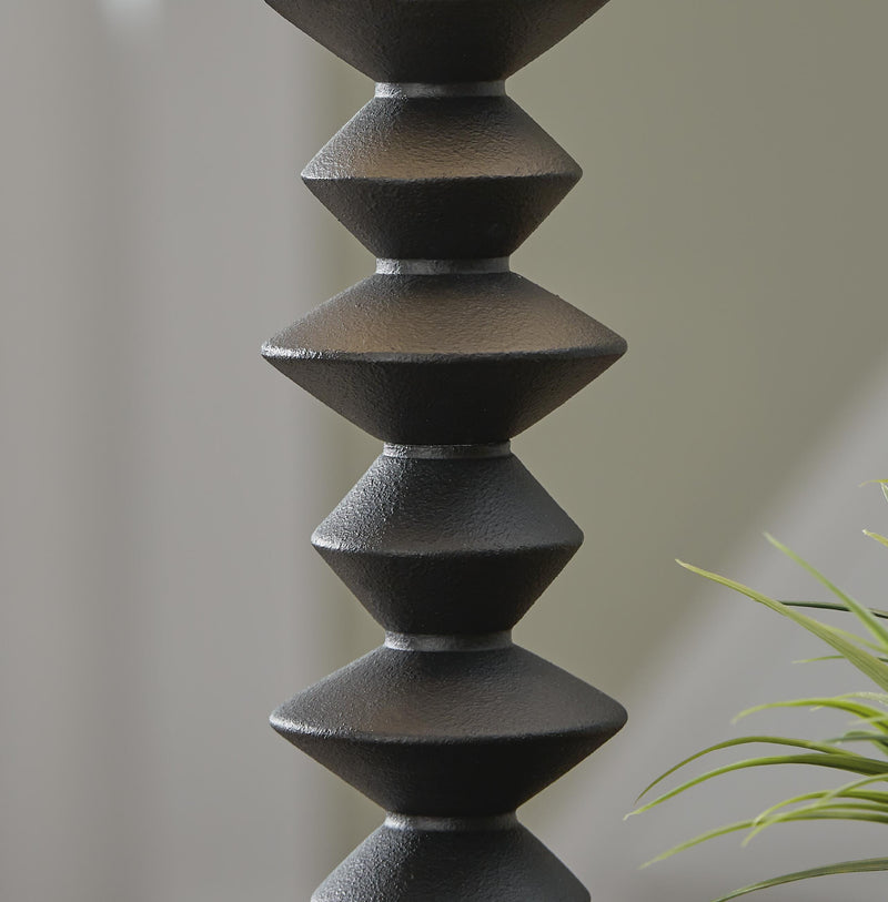 Luanndon table lamp set by Ashley Furniture featuring elegant ceramic bases and fabric shades on a wooden surface.