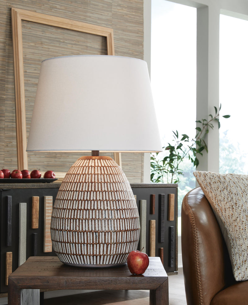 Ashley Furniture Darrich table lamp set featuring two stylish lamps with fabric shades and modern bases on a wooden surface.