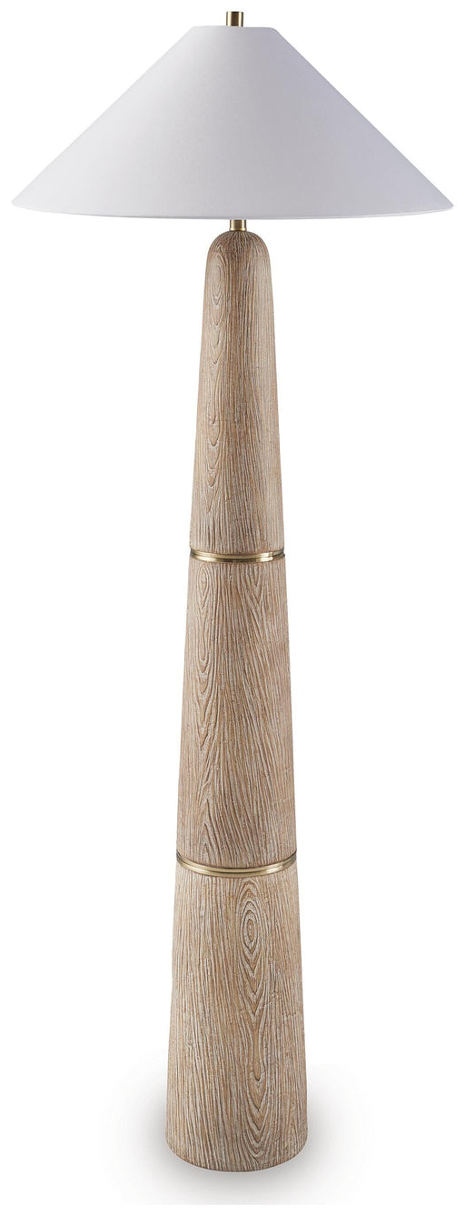 Gasparleigh floor lamp by Ashley Furniture with a tall metal base and fabric shade, standing on a wooden floor.