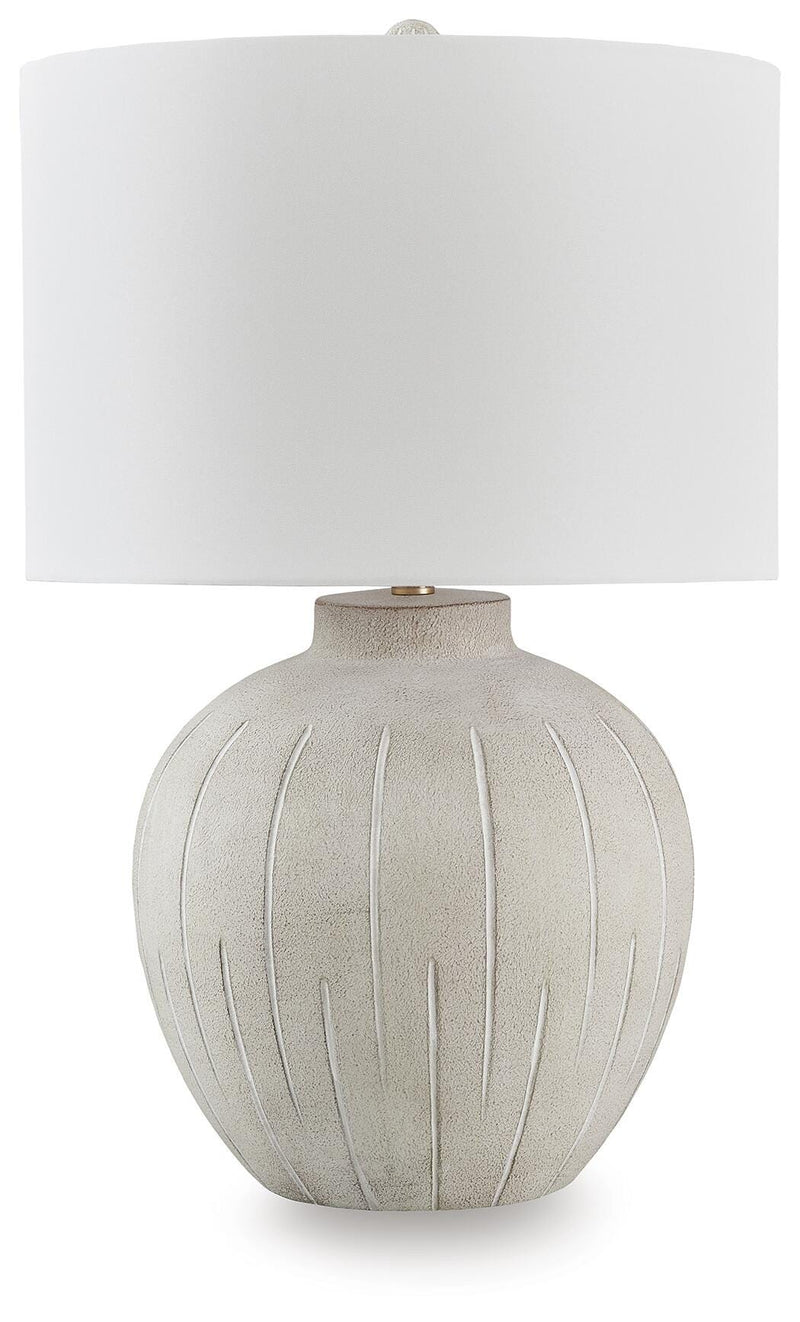 Ashley Furniture Calbert table lamp with a sleek base and fabric shade, perfect for modern living room or bedside decor.