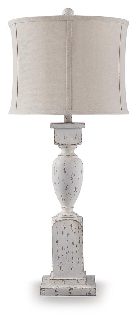 Ashley Furniture Madsbrook table lamp with a sleek base and fabric shade, ideal for enhancing living room or bedside decor.