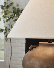 Ashley Furniture Ferrilby table lamp with a sleek base and fabric shade, ideal for modern living room or bedside decor.