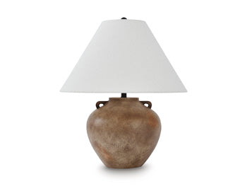 Ashley Furniture Ferrilby table lamp with a sleek design and fabric shade, placed on a wooden side table in a modern living room.