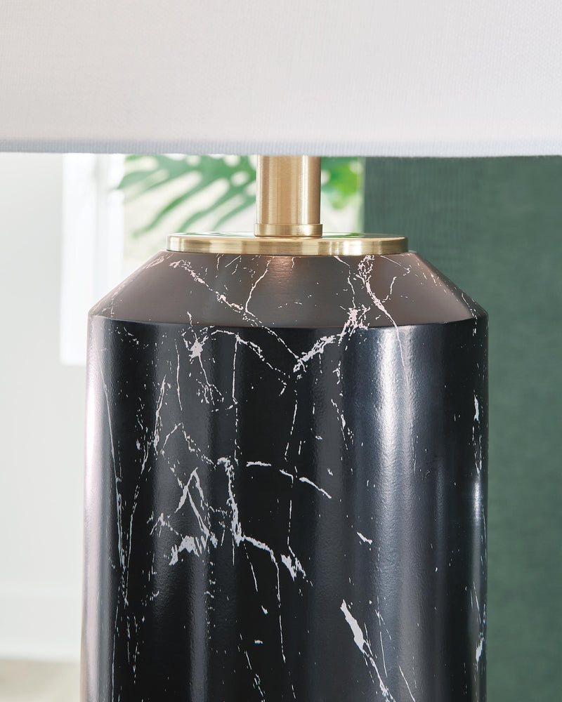 Ashley Furniture Hanzila table lamp with a sleek design, featuring a ceramic base and fabric shade for stylish lighting.