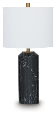 Hanzila table lamp by Ashley Furniture featuring a sleek base and fabric lampshade on a wooden side table.