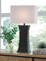 Ashley Furniture Golzar table lamp with a sleek base and fabric shade, ideal for modern living room or bedside decor.