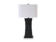 Ashley Furniture Golzar table lamp with a sleek design, featuring a modern base and a fabric lampshade.